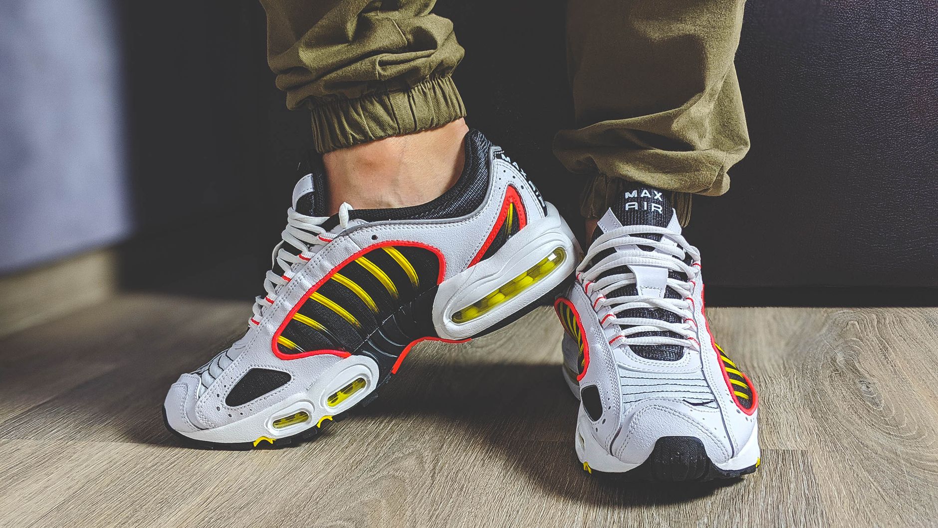 Close-up of fashionable Nike sneakers with yellow accents, perfect for modern footwear enthusiasts.