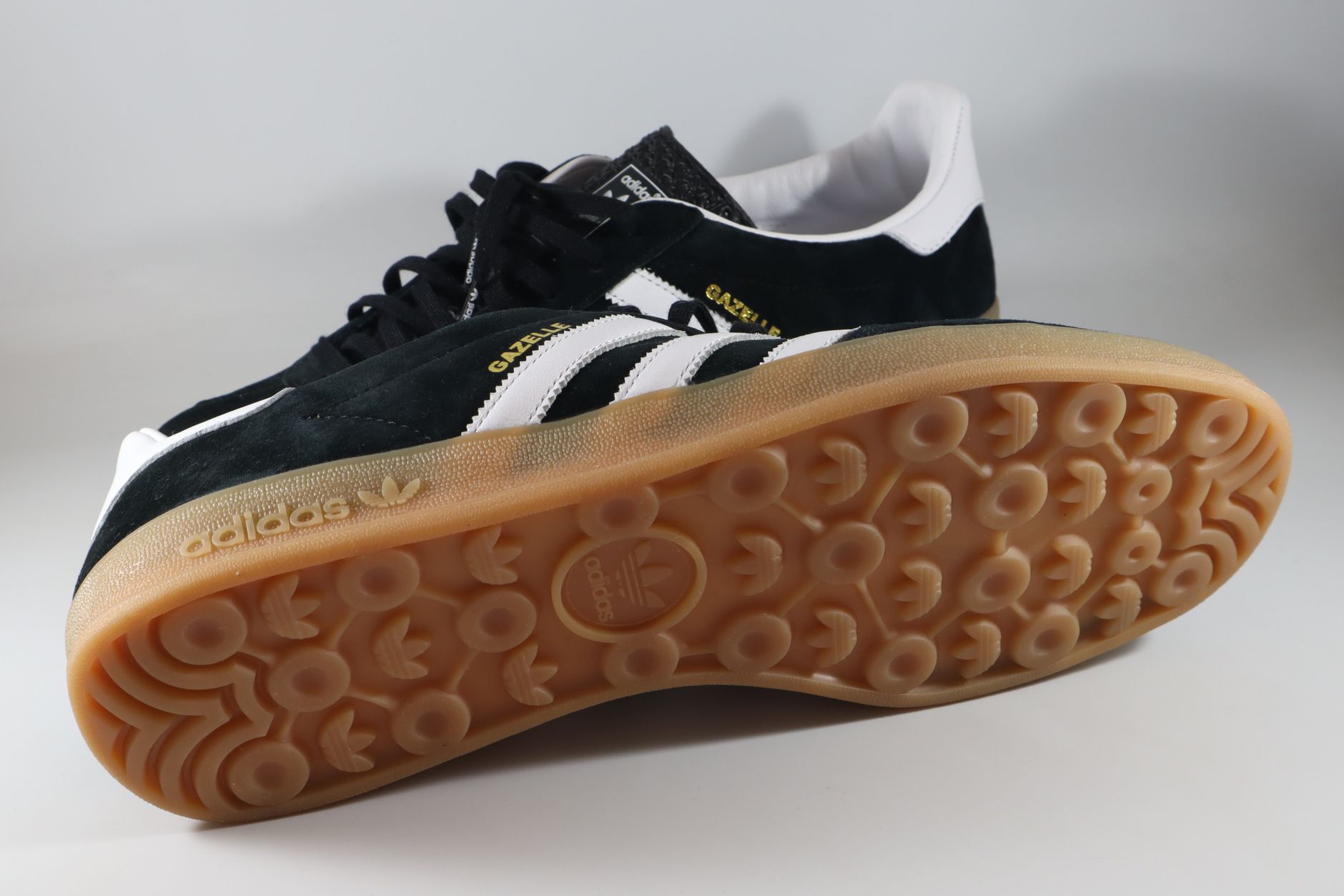 Stylish Adidas Gazelle sneakers featuring a detailed close-up of the sole and branding.