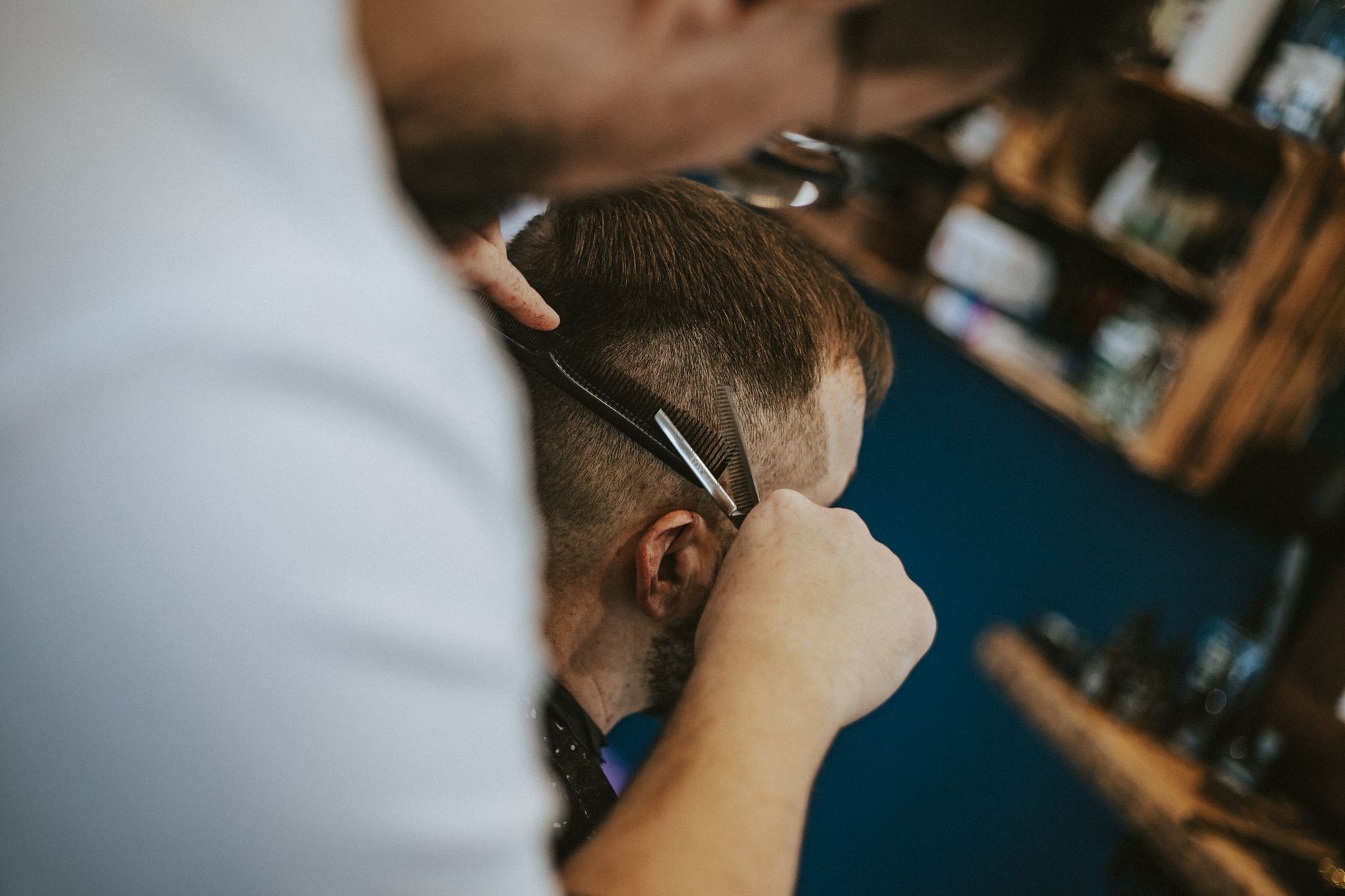 Haircut scene in a Polish barber shop capturing the art of modern grooming and styling.